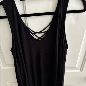 Ella Moss Black cold shoulder top. Criss cross top. Flairs at the bottom